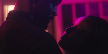 Still from the Kenyan romcom Sayari featuring lead actors Muhugu Theuri and Lucarelli Onyango.