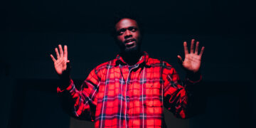 A still image of Francis Faiz Ouma during the staging of his one-man show It's Such a Good Time at the Kenya National Theatre.