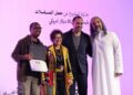 Tony Koros receiving the award for Money Town at the Red Sea Souk Awards.