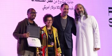 Tony Koros receiving the award for Money Town at the Red Sea Souk Awards.